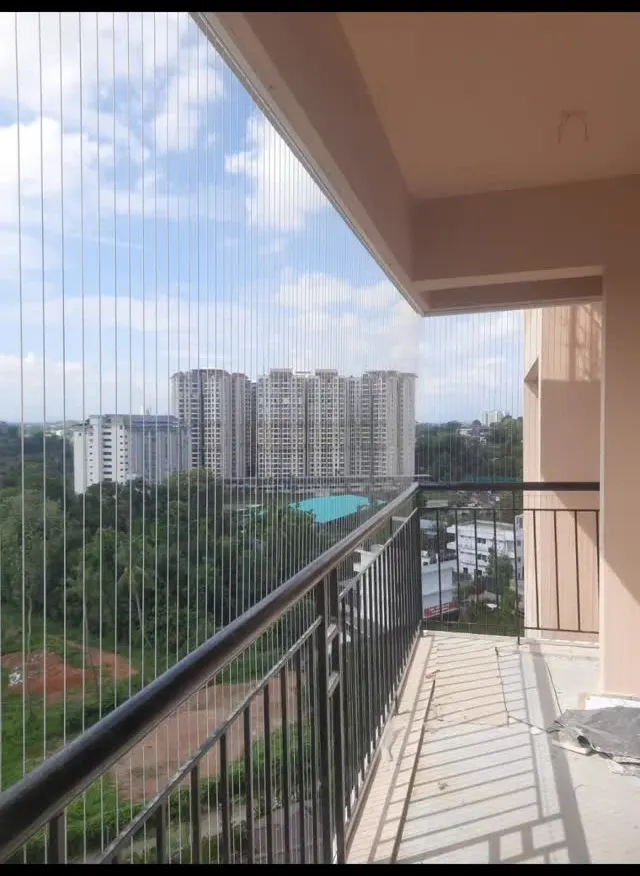Invisible grill installation overlooking a modern apartment complex